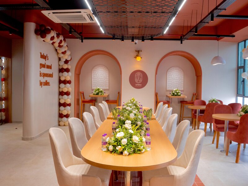 Premium cafe ambiance at Aristo Bapunagar showing modern design and welcoming atmosphere